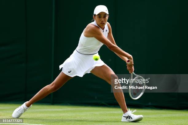 Shuai Zhang of People's Republic of China plays a backhand against Donna Vekic of Croatia in the Women's Singles first round match during day three...