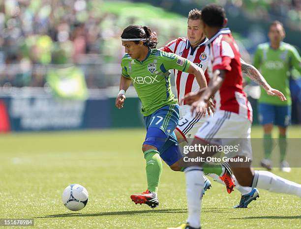 Fredy Montero of the Seattle Sounders FC dribbles against Chivas USA at CenturyLink Field on September 8, 2012 in Seattle, Washington.