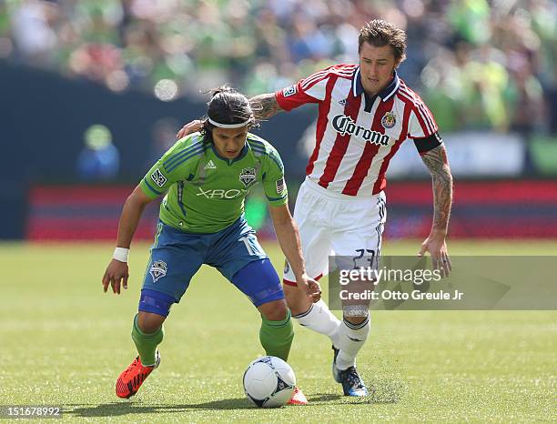 Fredy Montero of the Seattle Sounders FC dribbles against Chivas USA at CenturyLink Field on September 8, 2012 in Seattle, Washington.