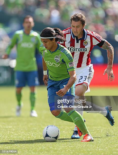 Fredy Montero of the Seattle Sounders FC dribbles against Chivas USA at CenturyLink Field on September 8, 2012 in Seattle, Washington.