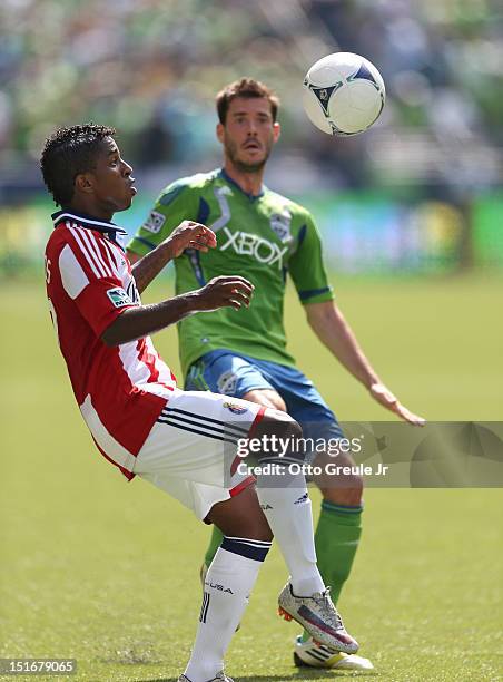 Miller BolaÃ±os of Chivas USA controls the ball against Brad Evans of the Seattle Sounders FC at CenturyLink Field on September 8, 2012 in Seattle,...