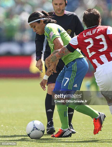Fredy Montero of the Seattle Sounders FC dribbles against Chivas USA at CenturyLink Field on September 8, 2012 in Seattle, Washington.
