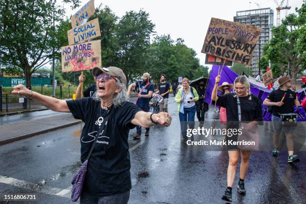 Aysen Dennis of Fight for Aylesbury marches with social housing campaigners from Southwark alongside the remaining section of the Aylesbury Estate...