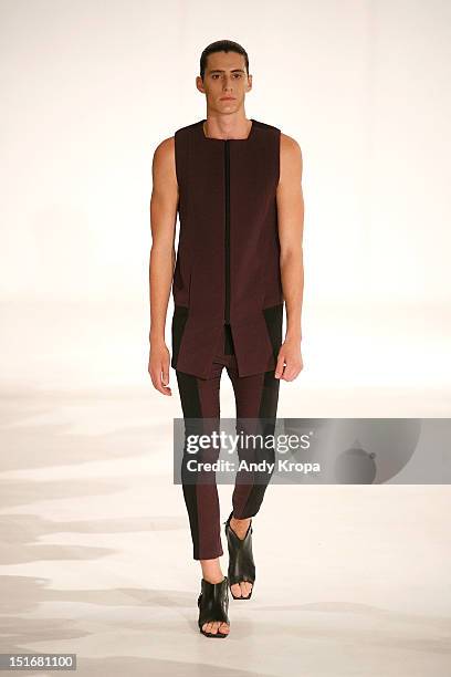 Model walks the runway at the Rad by Rad Hourani Unisex Collection spring 2013 fashion show during Mercedes-Benz Fashion Week at the Studio 450 on...