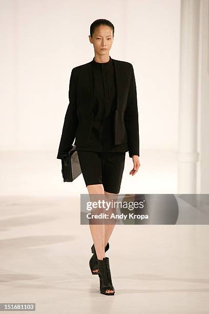 Model walks the runway at the Rad by Rad Hourani Unisex Collection spring 2013 fashion show during Mercedes-Benz Fashion Week at the Studio 450 on...