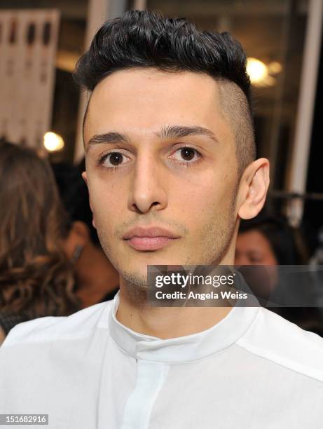 Designer Rad Hourani poses backstage at the Rad by Rad Hourani Unisex Collection spring 2013 fashion show during Mercedes-Benz Fashion Week at Studio...