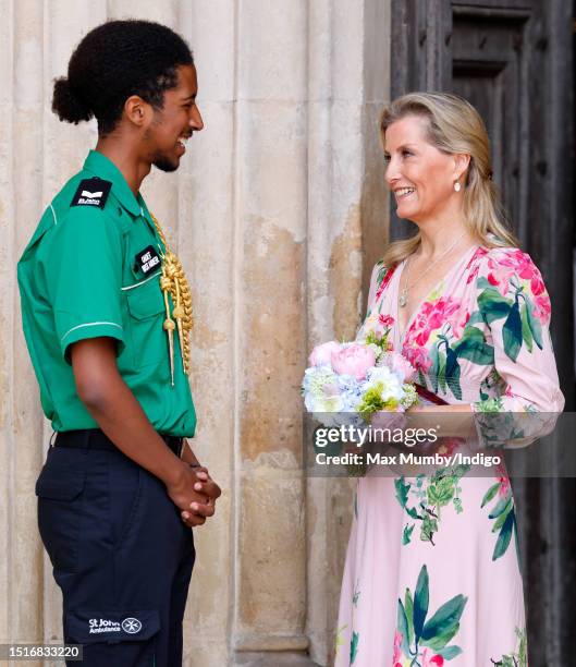 Sophie, Duchess of Edinburgh receives a posy of flowers from a St John Ambulance Cadet First Aider as she attends a service to celebrate the 75th...