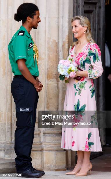 Sophie, Duchess of Edinburgh receives a posy of flowers from a St John Ambulance Cadet First Aider as she attends a service to celebrate the 75th...