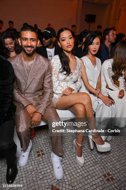 Salim Kechiouche and Ming Lee Simmons attend the Elie Saab Haute Couture Fall/Winter 2023/2024 show as part of Paris Fashion Week on July 05, 2023 in...