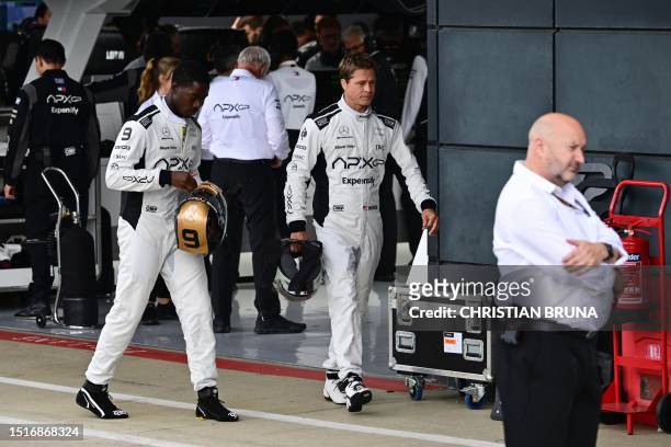 Actor Brad Pitt , starring as a driver in an F1-inspired movie, is seen during the Formula One British Grand Prix at the Silverstone motor racing...