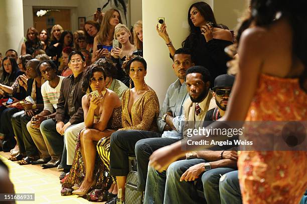 Personalities Laura Govan and Gloria Govan with NBA player Matt Barnes watch the Anna Francesca Spring 2013 fashion show during Mercedes-Benz Fashion...