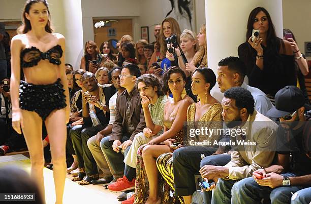 Personalities Laura Govan and Gloria Govan with NBA player Matt Barnes watch the Anna Francesca Spring 2013 fashion show during Mercedes-Benz Fashion...