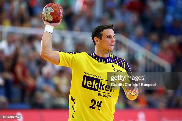 Bartolomiej Jaszka of Berlin passes the ball during the DKB Handball Bundesliga match between TUSEM Essen and Fueches Berlin at the Sportpark Am...