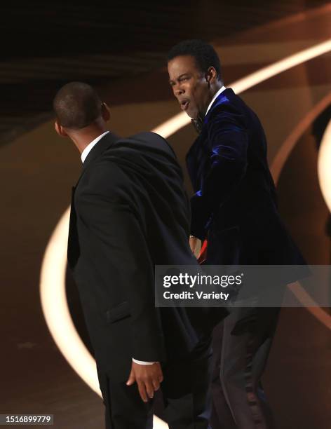 Chris Rock reacts to being slapped by Will Smith onstage at the 94th Academy Awards held at Dolby Theatre at the Hollywood & Highland Center on March...