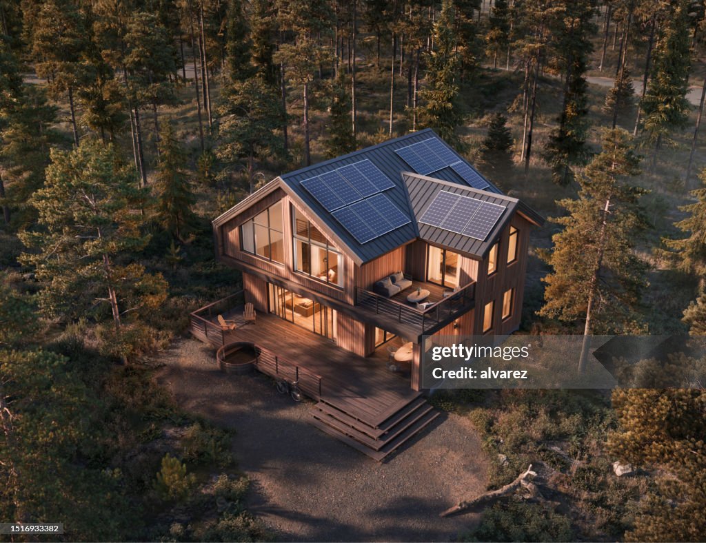 Aerial View Of A Modern Forest House At Sunset In 3d High-Res Stock ...