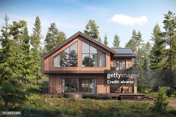 3d-rendering eines hölzernen waldhauses, umgeben von bäumen - einfamilienhaus stock-fotos und bilder