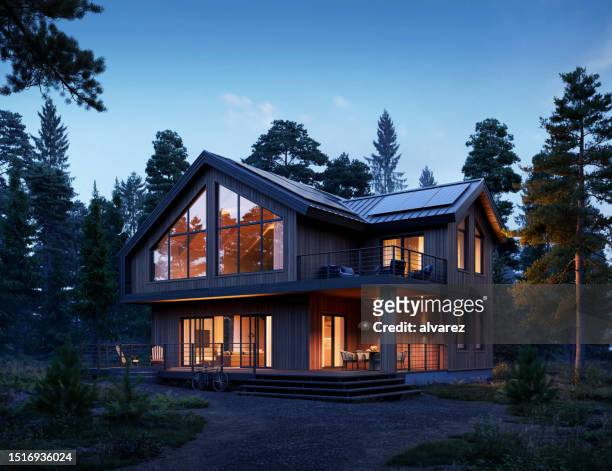 computer generated image of a beautiful home in the forest at night - detached house stock pictures, royalty-free photos & images