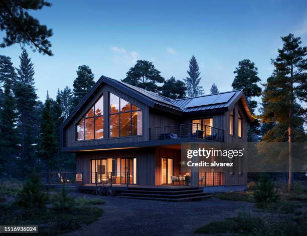 computer generated image of a beautiful home in the forest at night - solar panels sunset stock pictures, royalty-free photos & images