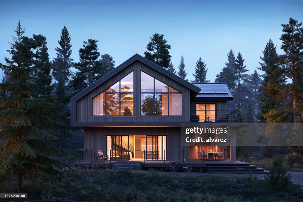 3d render of forest house with large windows at night