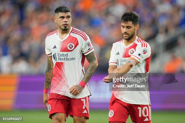 Gustavo Bou and Carles Gil of New England Revolution walk off the pitch following the first half of a MLS soccer match against FC Cincinnati at TQL...