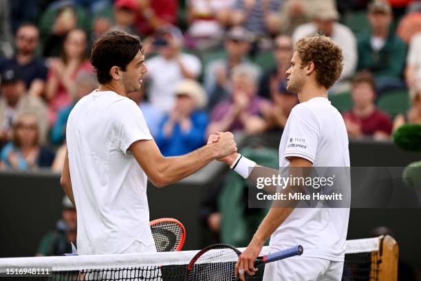 Taylor Fritz of United States shakes hands with Yannick Hanfmann of Germany following the Men's Singles first round match during day three of The...