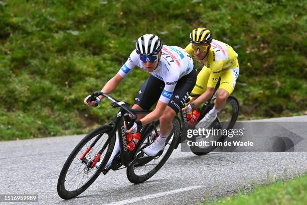 Tadej Pogacar of Slovenia - White best young jersey and Adam Yates of United Kingdom and UAE Team Emirates - Yellow leader jersey compete during the...