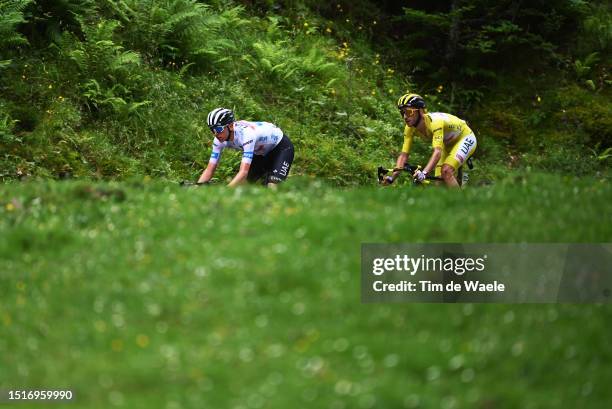 Tadej Pogacar of Slovenia - White best young jersey and Adam Yates of United Kingdom and UAE Team Emirates - Yellow leader jersey compete during the...