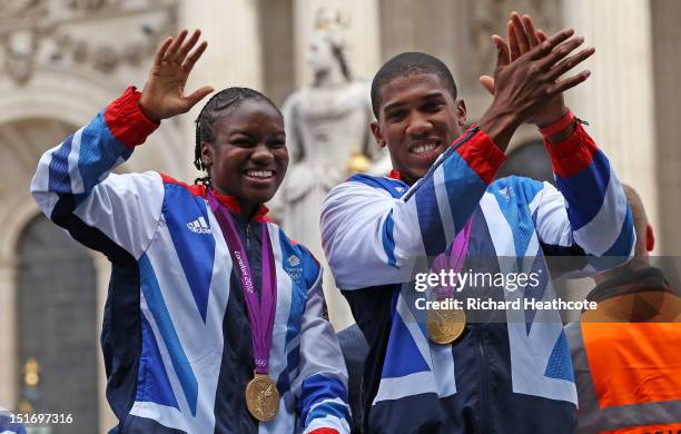 British Olympic boxing gold medalists Nicola Adams and Anthony Joshua wave to the crowd as as they go past St Paul's during the London 2012 Victory...