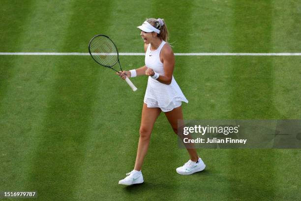 Katie Boulter of Great Britain celebrates winning match point against Daria Saville of Australia in the Women's Singles first round match during day...