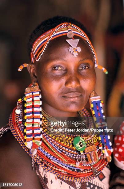Maasai woman dressed in decorative beads and necklaces in the Maasai Mara reserve in Kenya, East Africa in September 1988.