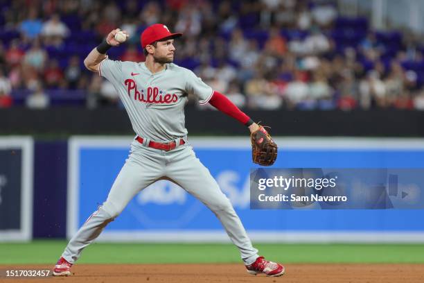 Trea Turner of the Philadelphia Phillies throws the baseball to Alec Bohm to retire Garrett Cooper of the Miami Marlins at loanDepot park on July 9,...