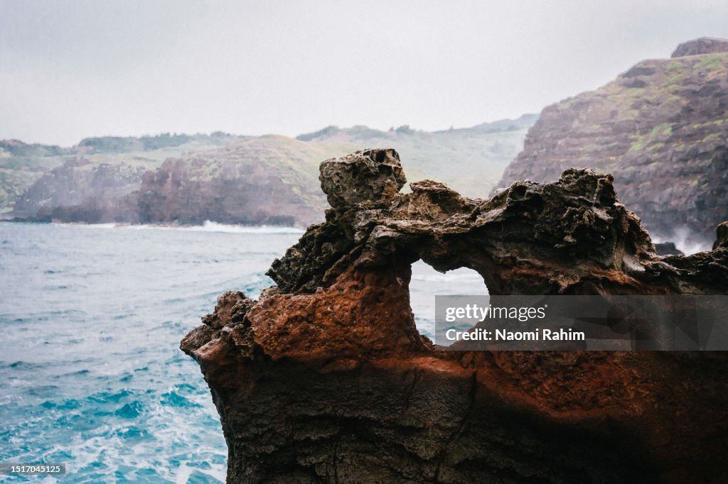Heart-shaped rock on coastline in Maui, Hawaii