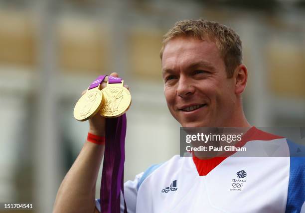 Olympic Cycling gold medallist Sir Chris Hoy takes part in the London 2012 Victory Parade for Team GB and Paralympics GB athletes through central...