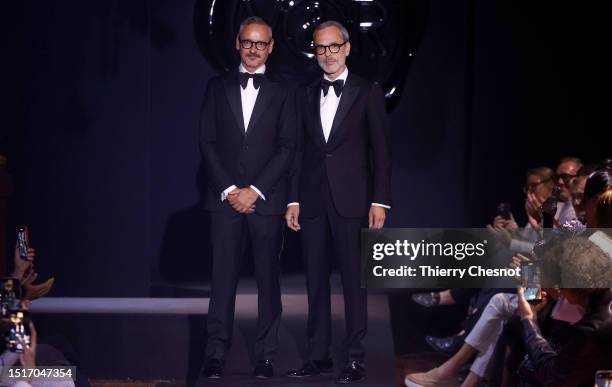 Dutch designers Viktor Horsting and Rolf Snoeren greet the audience after the Viktor & Rolf Haute Couture Fall/Winter 2023/2024 show as part of Paris...