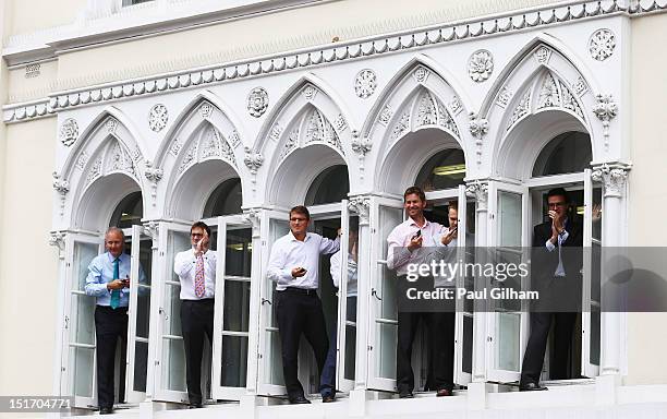 Members of the public cheer on the athletes as they take part in the =London 2012 Victory Parade for Team GB and Paralympics GB athletes through...