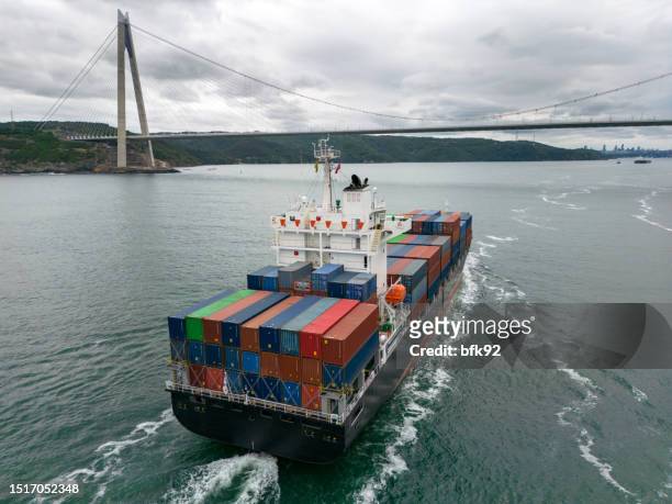 aerial view of container freight ship in transit. istanbul bosphorus - bosporus shipping trade stockfoto's en -beelden