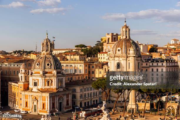 rome skyline with two churches and traian column at sunset, italy - roman column stock pictures, royalty-free photos & images