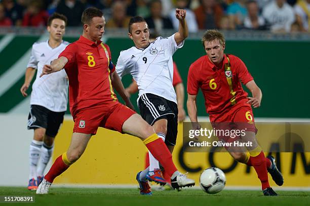 Samed Yesil of Germany and Gethin Jones of Wales battle for the ball during the Under 19 international friendly match between Germany and Wales at...