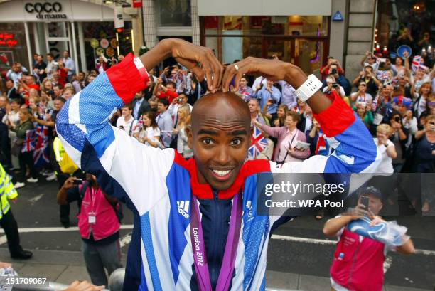 Gold Medal winner athlete Mo Farah performs a 'mobot' during the London 2012 Victory Parade for Team GB and Paralympic GB athletes on September 10,...