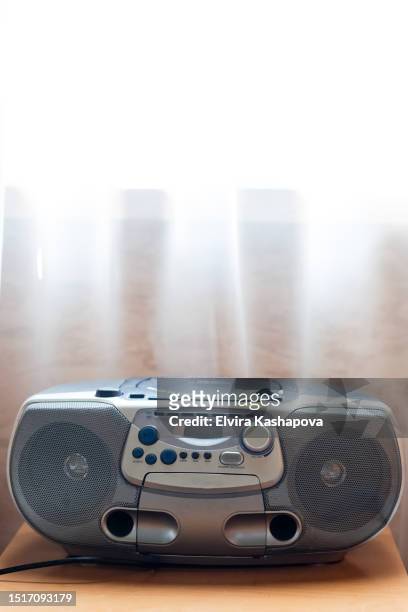 cassette tape recorder on the nightstand against the background of white tulle at home - new broadcasting house stock pictures, royalty-free photos & images