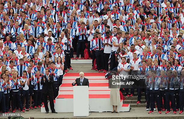 London Mayor Boris Johnson addresses athletes and spectators from the Queen Victoria Memorial outside Buckingham Palace as Britain's Prime Minister...
