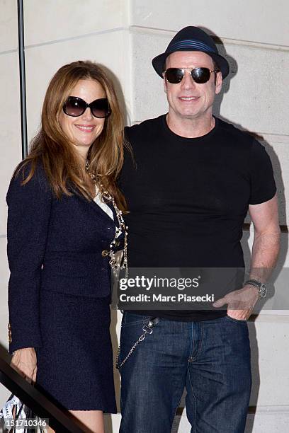 Actor John Travolta and his wife Kelly Preston are seen at the 'CHANEL' store on September 10, 2012 in Paris, France.