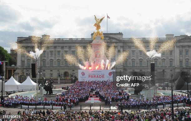 Fireworks spray from the Queen Victoria Memorial outside Buckingham Palace at the end of a parade celebrating Britain's athletes who competed in the...