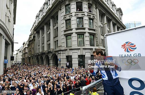 British gold medallist triathlete Alistair Brownlee waves to the crowd during the London 2012 Victory Parade for Team GB and Paralympics GB athletes...
