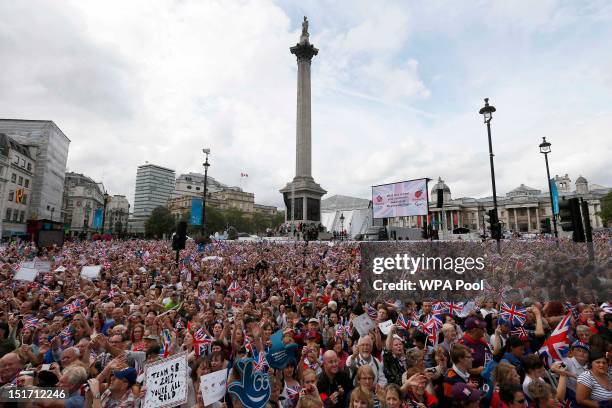 Spectators cheer on the athletes during the London 2012 Victory Parade for Team GB and Paralympic GB athletes on September 10, 2012 in London,...