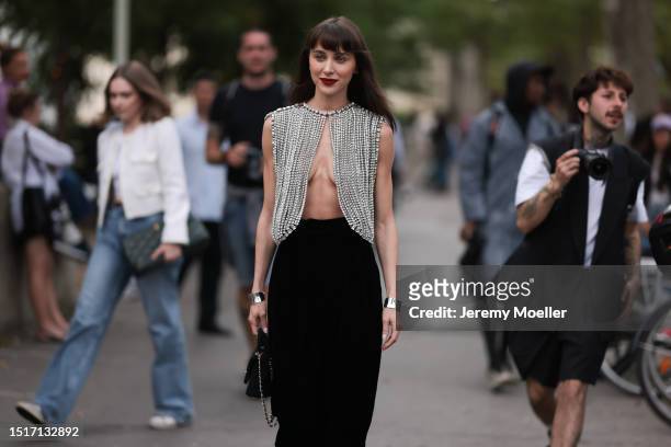 Mary Leest seen outside Alexandre Vauthier show wearing Alexandre Vauthier crystal top with open front and silver bracelets during the Haute Couture...