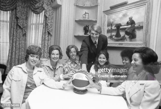 Dan Issel keeps it light in a picture of the ABA's Kentucky Colonels all women board of directors. Shown left to right: Ellie Brown the new board...