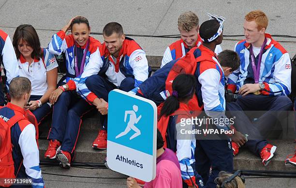 British Olympic heptathlon gold medalist Jessica Ennis along with other athletes arrive on The Mall during the London 2012 Victory Parade for Team GB...