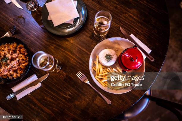 food on the table at restaurant - beer glass from above stock pictures, royalty-free photos & images