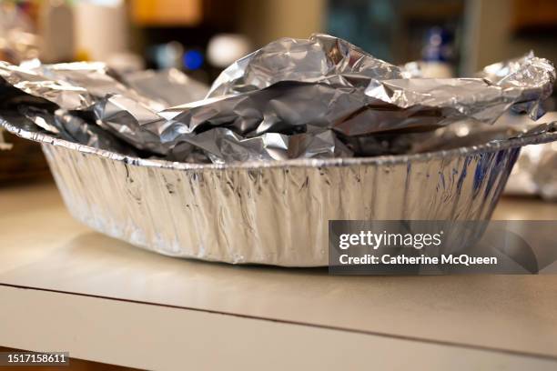 aluminum serving tray covered with foil - foil stock pictures, royalty-free photos & images